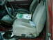 1987 Ford F-150 - Interior view of a 1987 Ford F-150, seats, steering wheel, and a box of motor oil on the passenger seat.