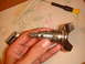 1992 Ford Bronco - A car door lock cylinder and handle are disassembled on a paper towel with a screwdriver nearby.