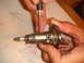 1992 Ford Bronco - A close-up view of an ignition lock cylinder being serviced.