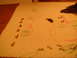 1992 Ford Bronco - Small metal parts and crayon drawings of a bottle and fruit are laid out on a paper towel.
