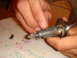 1992 Ford Bronco - Disassembled ignition lock cylinder with pins and tumblers laid out on a paper towel.