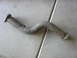 1996 Ford Probe - A single exhaust pipe with flanges on both ends and a metal hanger bracket is shown against a concrete background.