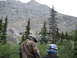 2008 Honda RANCHER - Two individuals in protective gear observe a vast mountainous landscape.