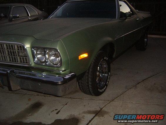 Green 1972 Ford Ranchero front corner, grille visible, headlight on