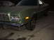 1973 Ford Ranchero - A green 1972 Ford Ranchero is viewed from the front three-quarter angle at night.