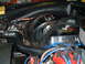 1978 Ford Ranchero - Close-up view of the engine bay, focusing on the battery, starter solenoid, and various electrical connections.