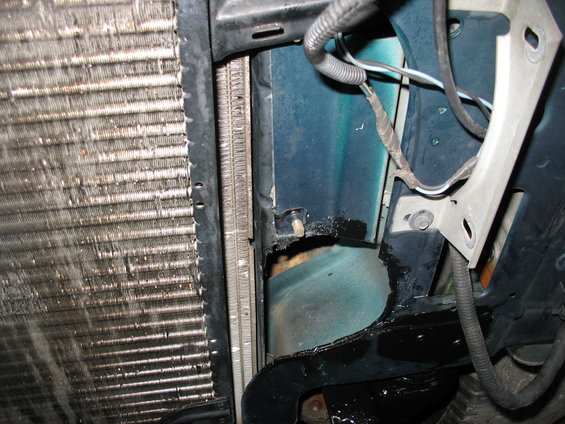 1995 Ford C-350 (Centurion Conversions) radiator and engine bay with teal paint and exposed wiring
