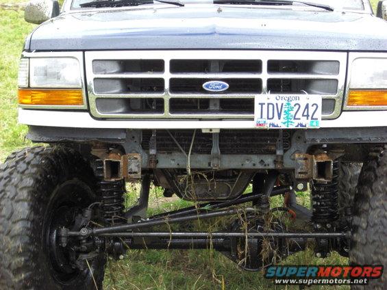 Dark blue 1992 Ford Bronco front grille and suspension with large tires