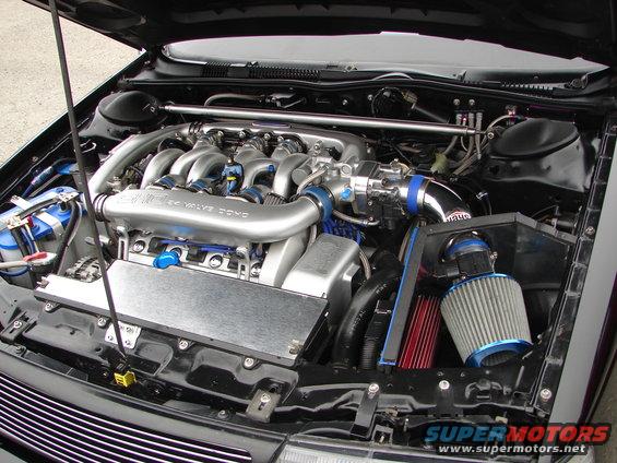 Engine bay with custom intake and 24 valve DOHC engine