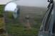 1990 Chevrolet Suburban - An off-road vehicle navigates a dirt track in a misty, green terrain.