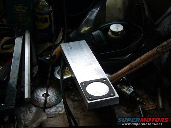 tbspacer-001.jpg Ok, I decided to make a throttle body spacer for my jeep. I've heard they aren't worth much on the 4.0 but I have to think that anything would help that crappy log manifold. In this pic I'm using a new gasket to lay out the cut lines and the hole.