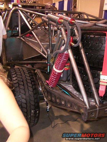 Off-road buggy rear suspension with dual shocks and red coilover