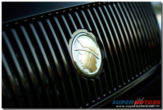 Close-up of the Mercury emblem on the grille of a 2003 Mercury Marauder
