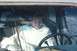 1990 Chevrolet Suburban - A person sits in the interior of a vehicle, wrapped in a blanket.