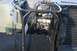 1990 Chevrolet Suburban - Close-up view of the engine bay and protective roll cage structure on a utilitarian vehicle.