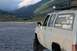 1990 Chevrolet Suburban - Chevrolet Suburban parked in a riverbed with mountains behind it. Stickers adorn the rear window.