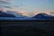 1990 Chevrolet Suburban - Mountain range and glacier at sunset, with a rocky foreground.