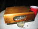1995 Ford C-350 (Centurion Conversions) - A wooden tray with a handle is shown, resting on a glass jar with liquid.