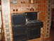 2001 Ford Mustang - An antique stove with a kettle on its burners, surrounded by decorative tilework.