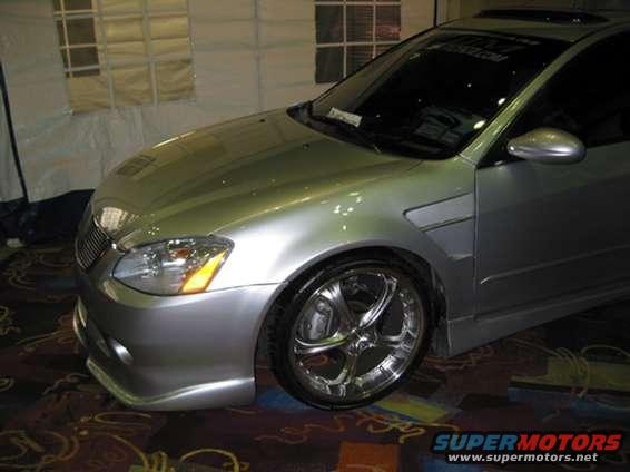 Silver 2002 Nissan Altima 3q-front view with custom wheels