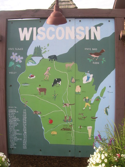 Wisconsin map sign with state symbols and cities listed