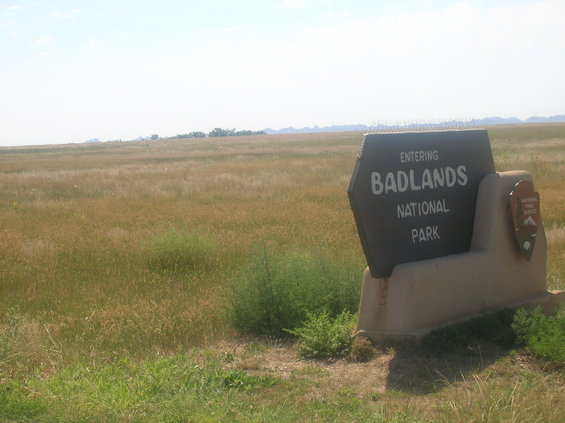 Sign for Badlands National Park in a grassy field
