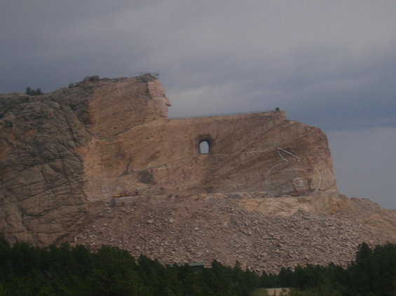 Crazy Horse Memorial mountain carving with a tunnel opening
