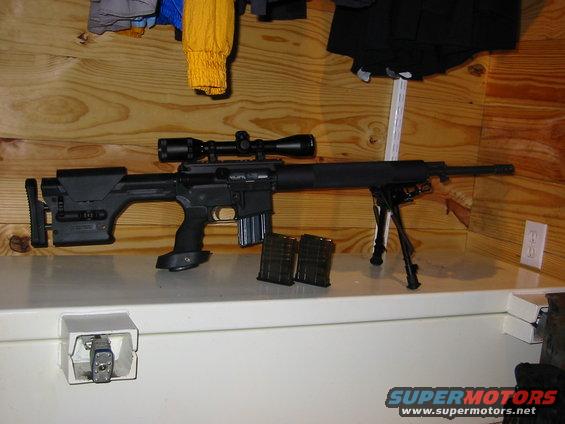 Sniper rifle with scope, bipod, and two magazines