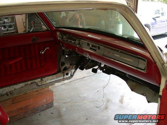 1964 Ford Ranchero interior, red door panel, dashboard, and seats, undergoing restoration