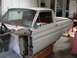 1964 Ford Ranchero - A 1964 Ford Ranchero body is shown in a workshop, with its front end removed for repairs.
