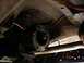 1979 Ford Bronco - Transmission and exhaust components visible from underneath a vehicle. Supermotors.net logo present.