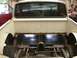 1964 Ford Ranchero - Rear view of a 1964 Ford Ranchero pickup truck, showing the bed and custom chassis modifications.
