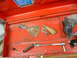 1985 Ford Bronco - A collection of assorted tools are organized inside an open red toolbox.