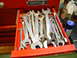 1985 Ford Bronco - A collection of wrenches is neatly organized within an open red tool drawer.