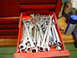 1985 Ford Bronco - A red toolbox drawer is filled with various wrenches and other tools.
