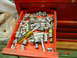 1985 Ford Bronco - A red toolbox drawer is open, revealing a collection of various sockets and wrenches, along with a yellow-handled screwdriver.