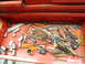 1985 Ford Bronco - A red toolbox drawer is filled with a variety of hand tools, such as sockets, screwdrivers, and pliers, ready for use.