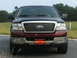 2005 Ford F-150 - Front view of a maroon Ford F-150 truck, likely a 2004 model, with a Harlem Fire Department plate.