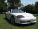 1992 Dodge Stealth - A white 1992 Dodge Stealth sports car is shown from a three-quarter front view, parked outdoors on a grassy lawn.
