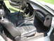 1992 Dodge Stealth - Interior view of a 1992 Dodge Stealth, highlighting the driver's seat and dashboard with the passenger door open.