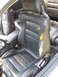 1992 Dodge Stealth - Interior view of black leather seats showing extensive damage and wear.
