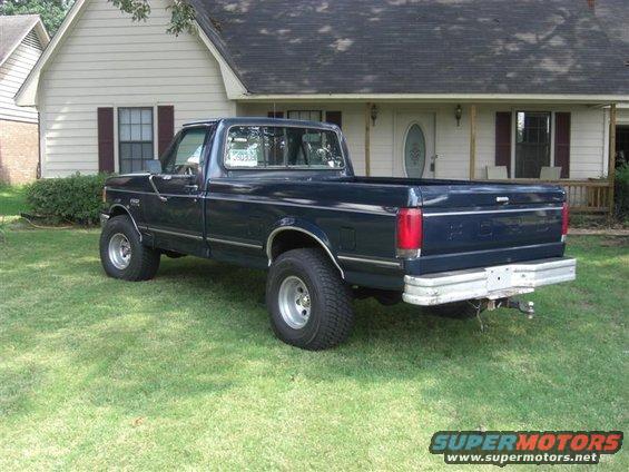 Dark blue 1989 Ford F-150 pickup truck, rear 3/4 view