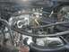 1989 Ford Bronco - Close-up view of an engine bay, showing various hoses, wires, and engine parts.
