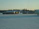 1995 Mercury Grand Marquis - Tanker trucks are parked in a snowy field under a clear sky. A Norstar trailer is visible on the right side of the image.