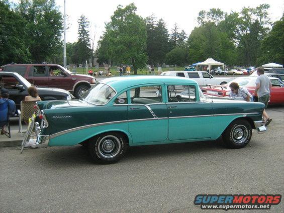 Two-tone green and teal 1956 Chevrolet sedan, side view