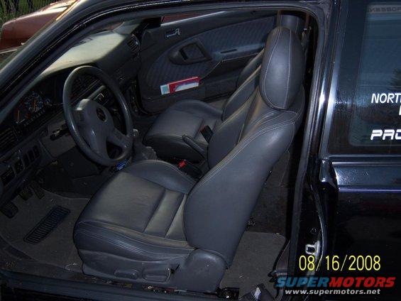 Interior view of a 1989 Mazda MX-6 showing gray leather seats and dashboard