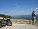 2008 Honda RANCHER - ATV parked on a mountain trail with a person observing the view.