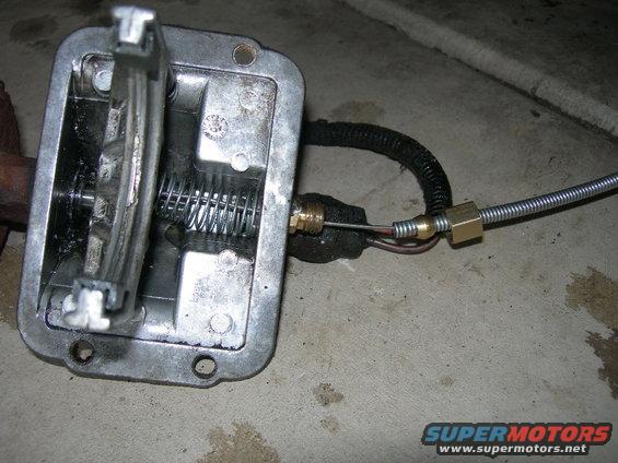 Transfer case shifter mechanism with internal spring and cable linkage
