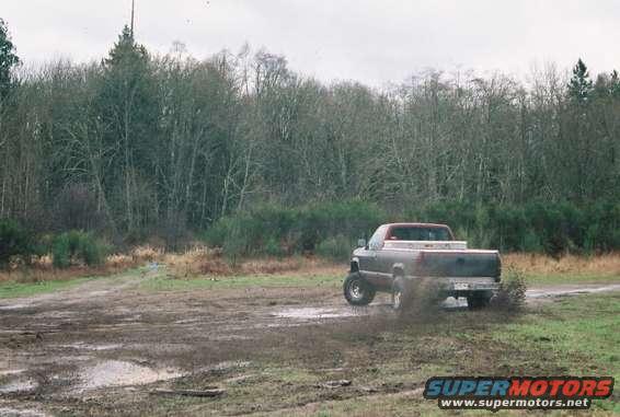 slingin.jpg My buddie Dan showed me how you check to see if your Half shafts are ready for replacement, Problem is he didn't know one was ready for replacement until it shotgunned itself shortly after I took this pic. 