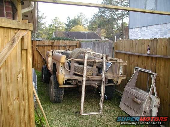 1971 Ford Bronco rear view with spare tires in bed and detached door